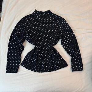 Black and white polka dot long sleeve blouse with mock neck